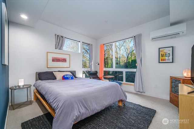 carpeted bedroom featuring a wall unit AC