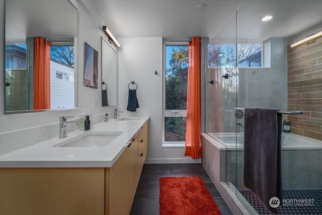 bathroom featuring vanity, plus walk in shower, and tile patterned flooring