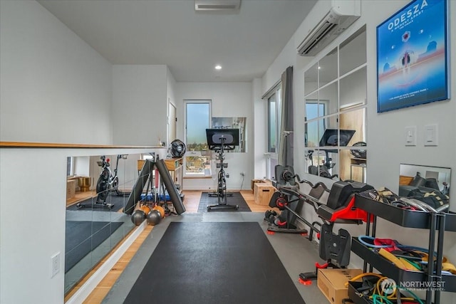 workout area featuring a wall mounted AC