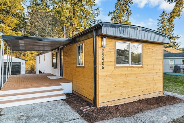 view of side of home with an outdoor structure