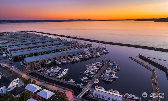 aerial view at dusk with a water view