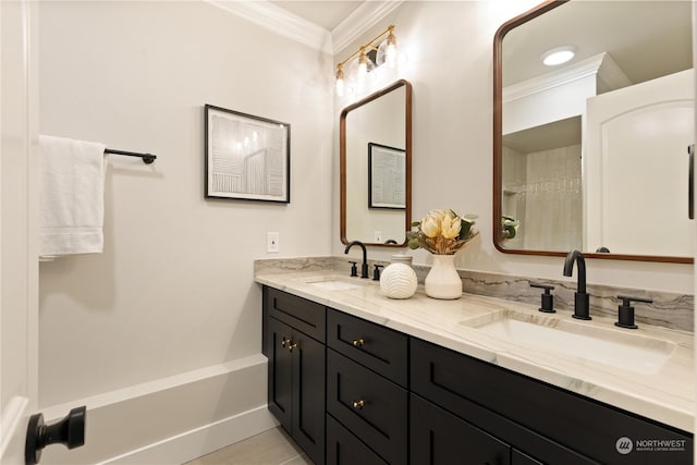 bathroom featuring crown molding and vanity