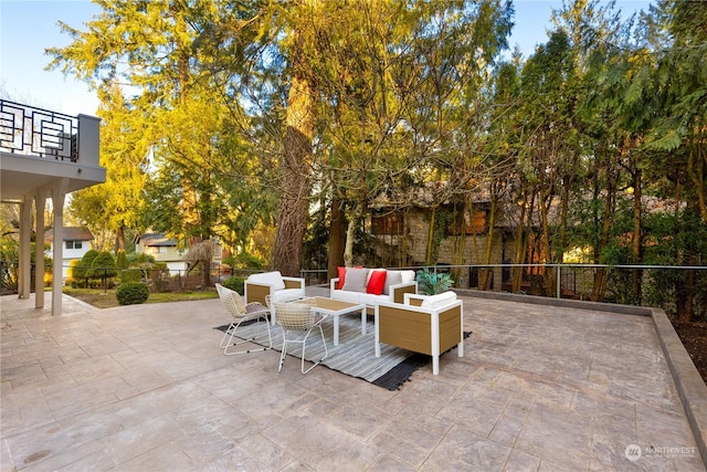 view of patio / terrace featuring an outdoor living space and a balcony