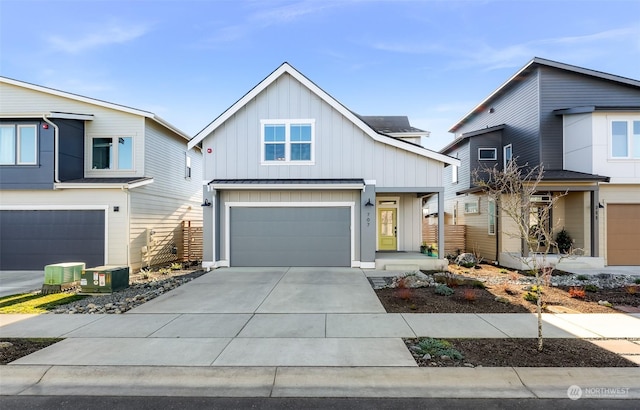 view of front of house featuring a garage and central air condition unit