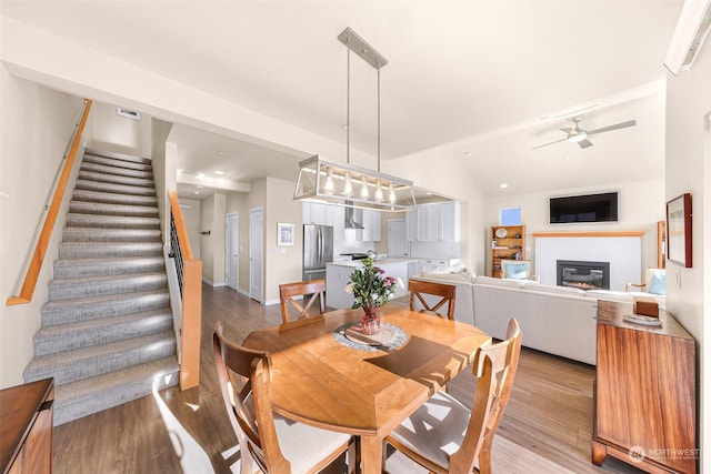 dining room featuring light hardwood / wood-style floors and ceiling fan