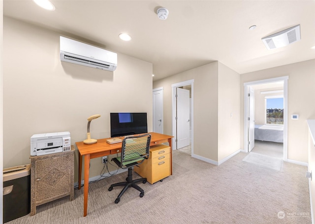 home office with carpet flooring and a wall mounted AC