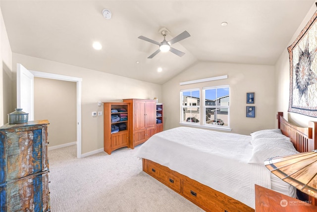 carpeted bedroom with vaulted ceiling and ceiling fan