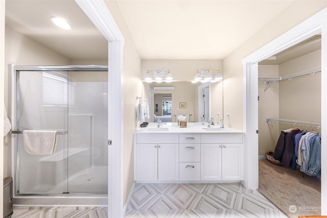 bathroom with vanity and an enclosed shower