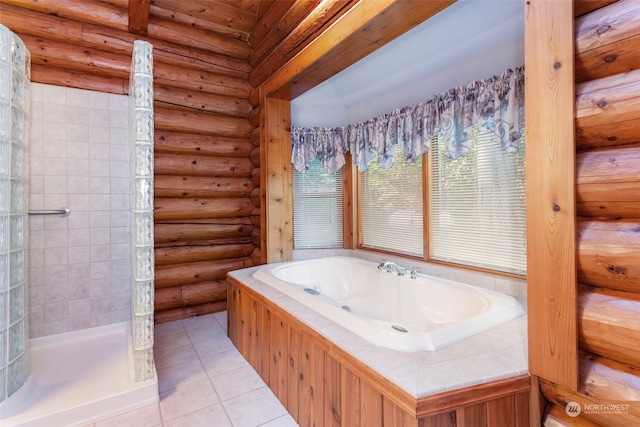 bathroom with tile patterned flooring, separate shower and tub, and rustic walls