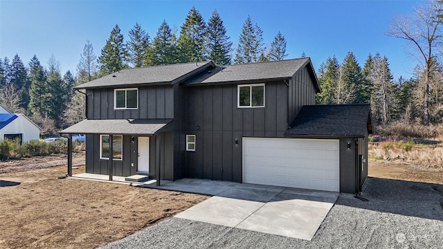 view of front of property with a porch and a garage