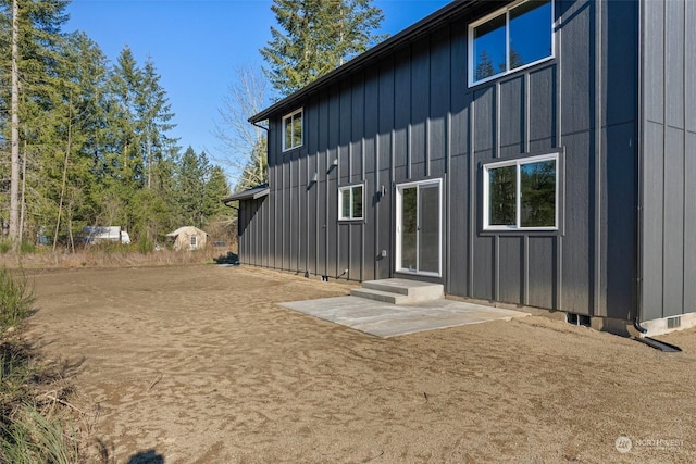 back of house with a patio