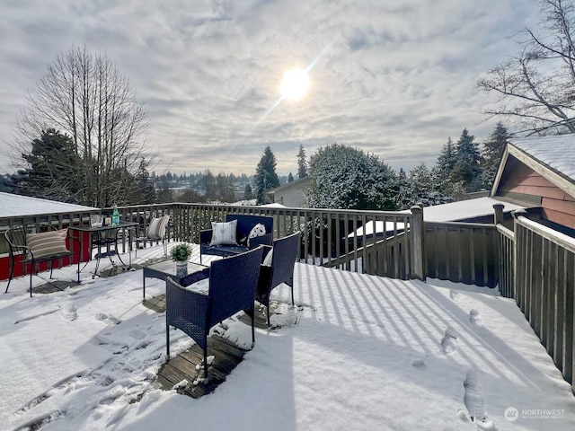 view of snow covered deck