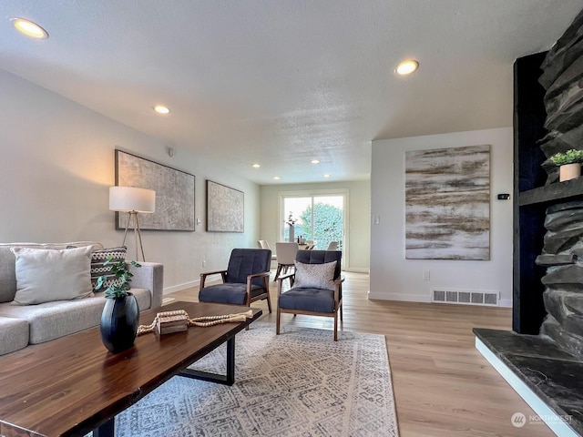 living room with light hardwood / wood-style flooring