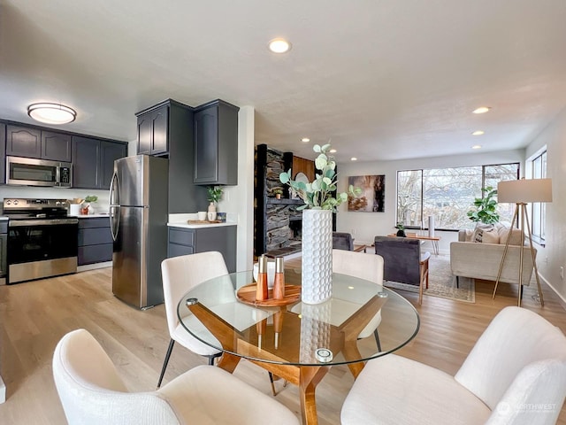 dining room with light hardwood / wood-style flooring