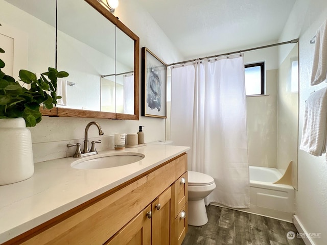 full bathroom with shower / bathtub combination with curtain, vanity, hardwood / wood-style flooring, and toilet