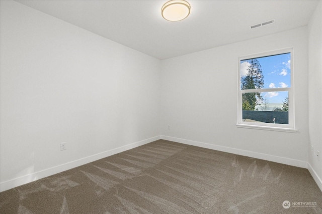 empty room with carpet flooring