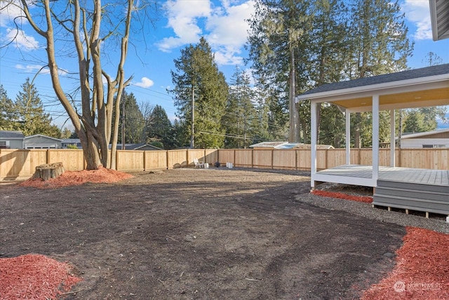 view of yard with a wooden deck