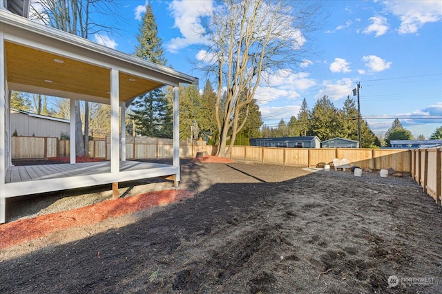 view of yard featuring a deck