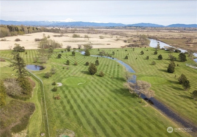 drone / aerial view featuring a water and mountain view and a rural view