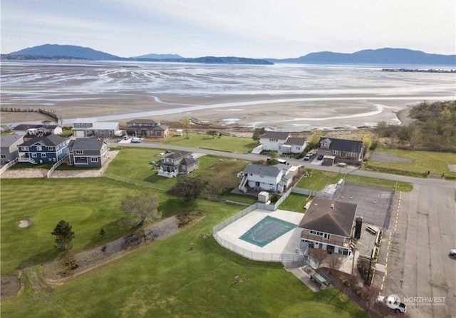 birds eye view of property featuring a water and mountain view