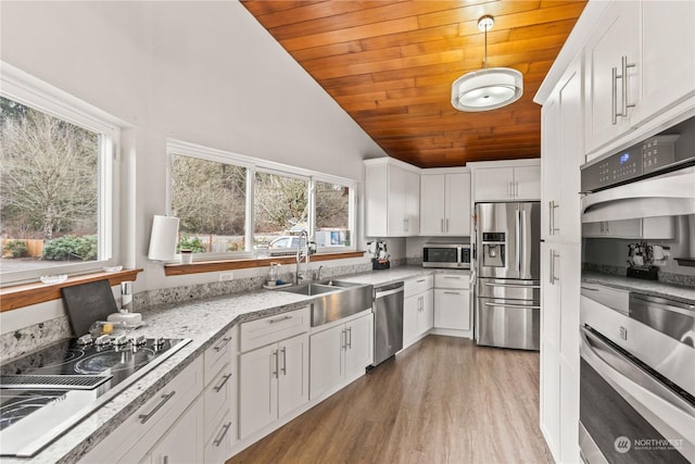 kitchen featuring sink, white cabinetry, wooden ceiling, appliances with stainless steel finishes, and light stone countertops