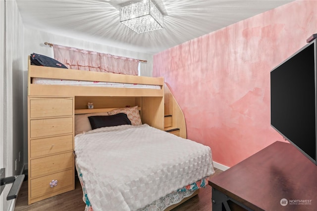 bedroom featuring dark wood-type flooring