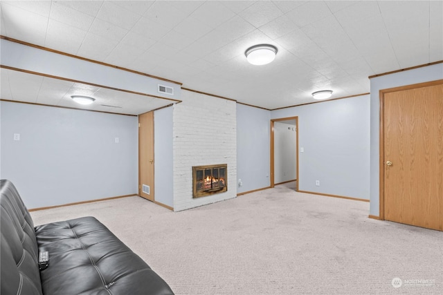 unfurnished living room with light colored carpet, ornamental molding, and a brick fireplace