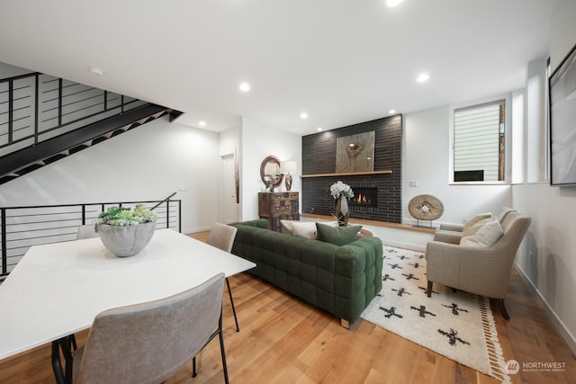 living room featuring a fireplace and light hardwood / wood-style floors