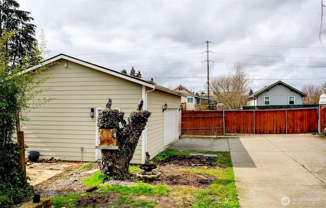 view of side of home with fence