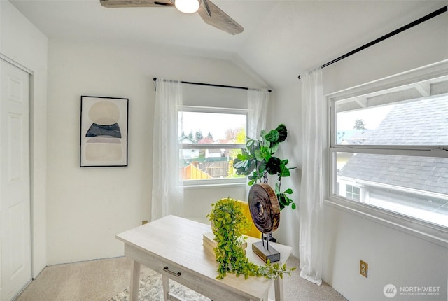 office with a ceiling fan and vaulted ceiling