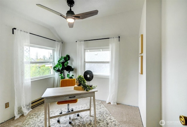 office with vaulted ceiling, light colored carpet, baseboard heating, and ceiling fan