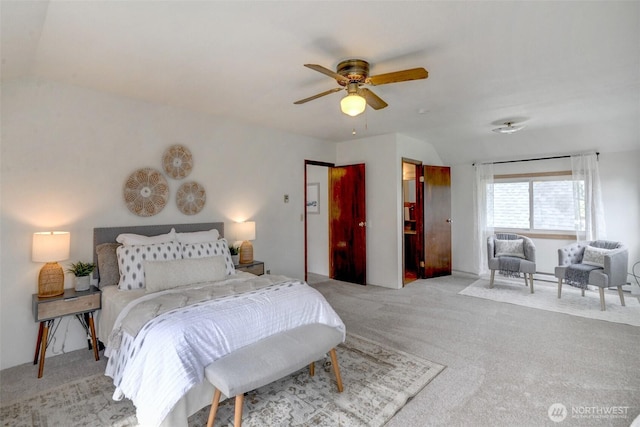 bedroom with carpet floors, ceiling fan, and vaulted ceiling