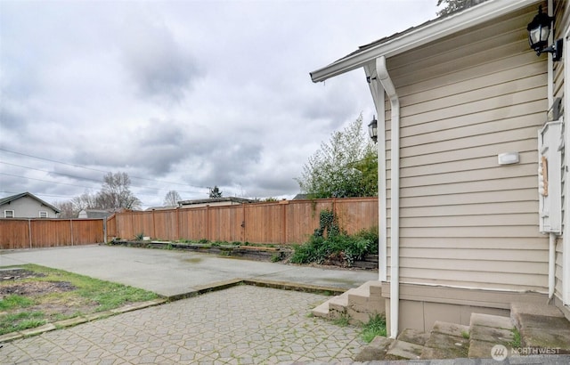 exterior space with a fenced backyard