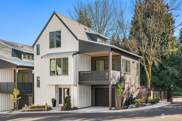 view of front of property with a balcony and a garage