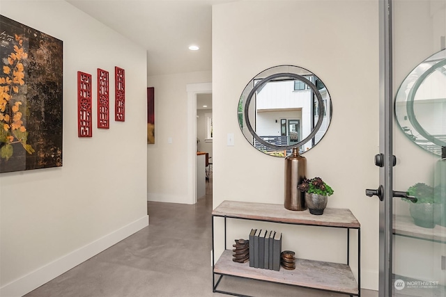 hallway featuring concrete flooring