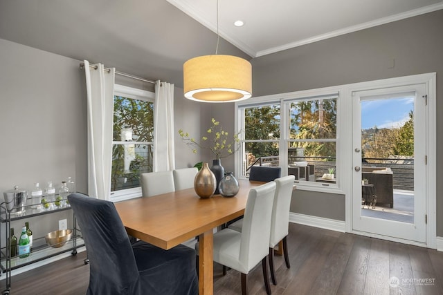 dining space with ornamental molding and dark wood-type flooring