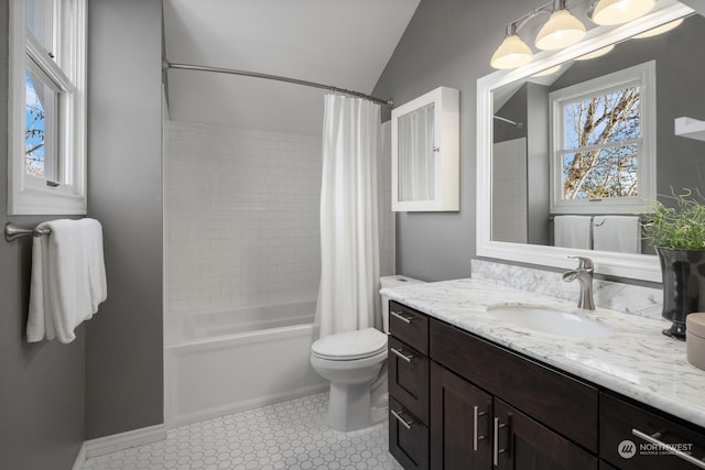 full bathroom featuring shower / tub combo, vanity, lofted ceiling, and toilet