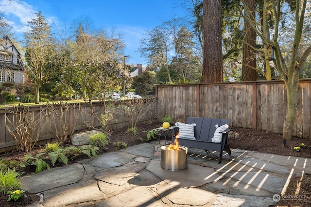 view of patio / terrace with a fire pit