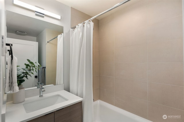 bathroom featuring vanity and shower / tub combo