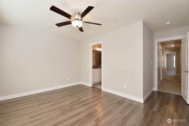 unfurnished room with ceiling fan and wood-type flooring