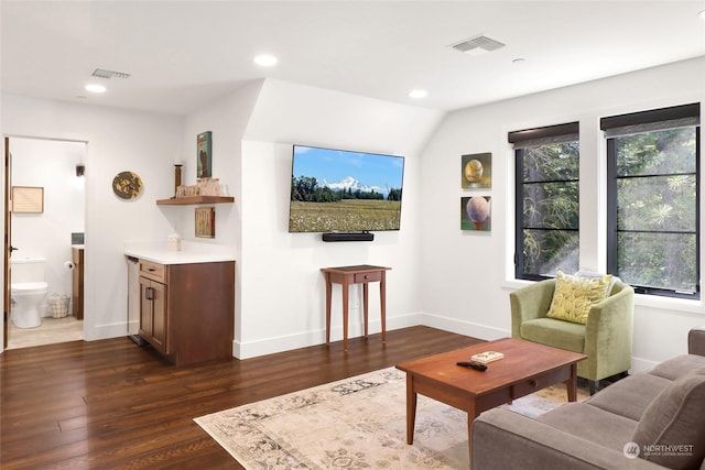 living room featuring dark wood-type flooring