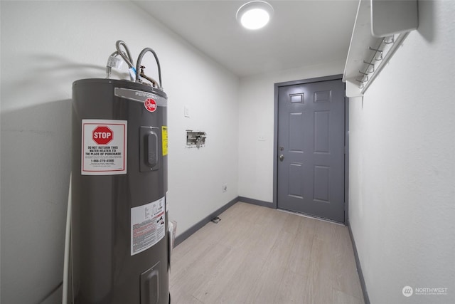 utility room with electric water heater