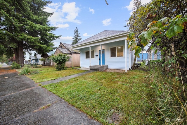 bungalow-style house featuring a front yard and a porch