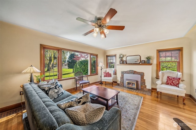 living room featuring hardwood / wood-style floors and ceiling fan