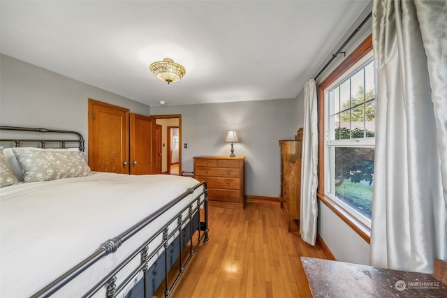 bedroom with light hardwood / wood-style floors