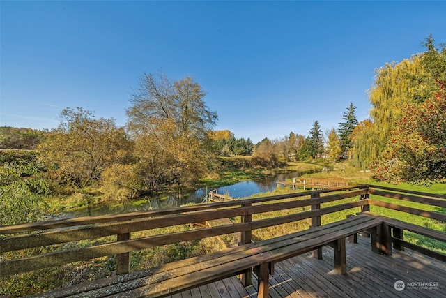 deck featuring a water view