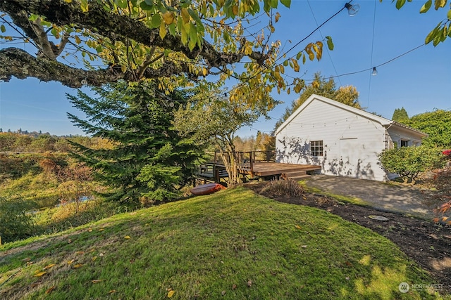 view of yard with a wooden deck