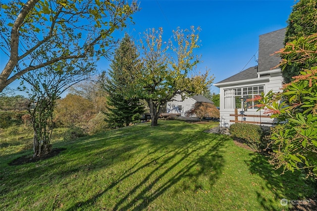 view of yard with a sunroom