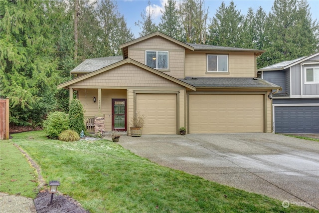 view of front of home with a garage and a front lawn