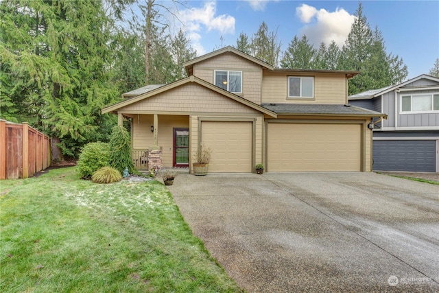 view of front of house with a garage and a front yard